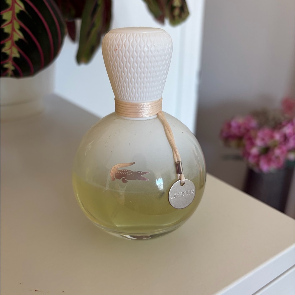 Lacoste Round Perfume Bottle in Pale Yellow & Clear